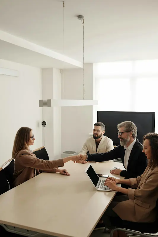 a professional handshake or team collaboration