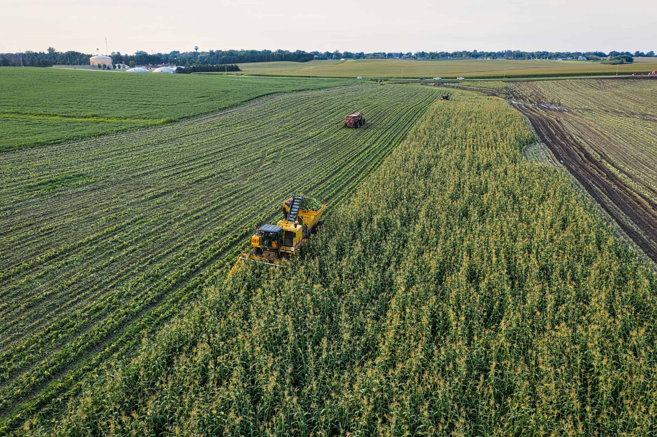 drone view of farmland or farmer using techtablet in the field